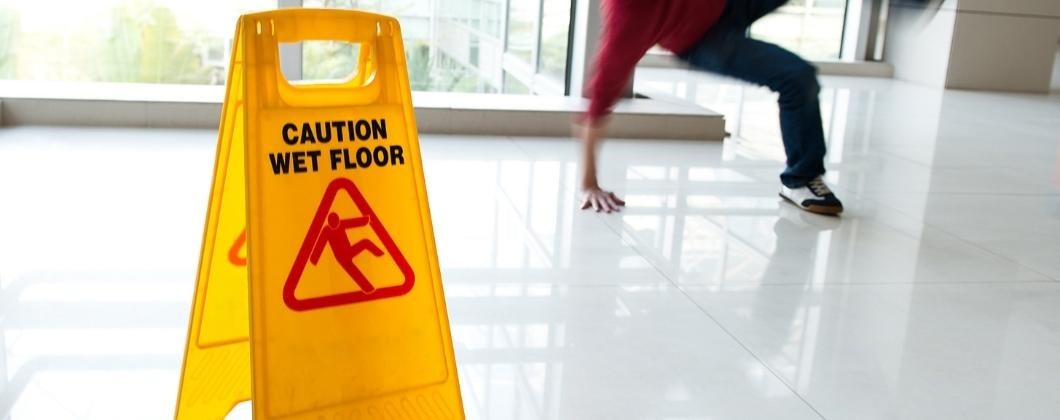Wet floor sign showing the need for Risk management
