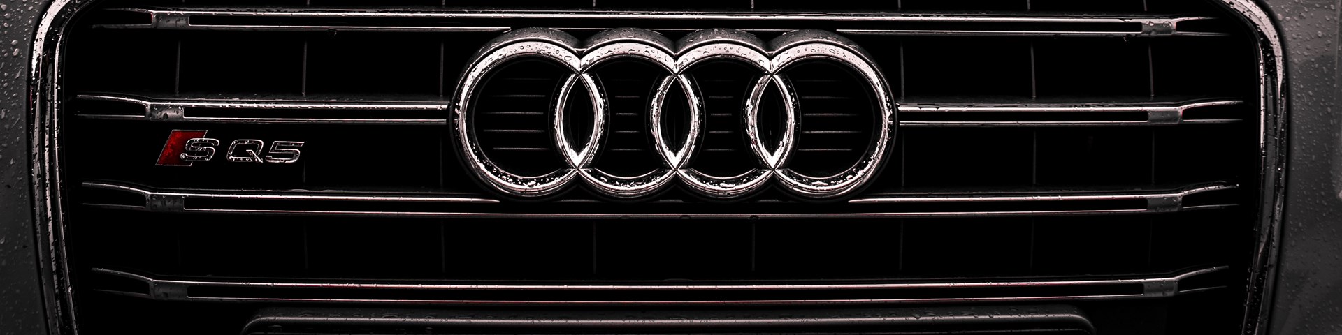 Rain covered Audi car covered by cheap car insurance 
